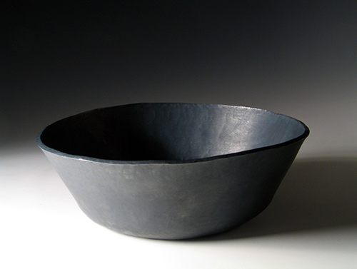 A patinated fine silver bowl